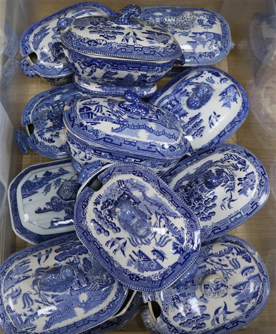 A collection of small blue and white tureens and covers